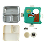 The disassembled green dinosaur lunchbox set, showing the stainless steel tray, plastic outer shell, inner divider, spoon,