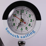 Ship shape clock lamp lit on table showing warm LED ambiance