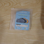 Small white waterproof silicone rain shoe cover in a daily use scenario.