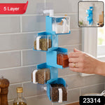 A blue 5-layer rotating spice rack on a tiled wall, with a red '5 Layer' label and product number '23314'.