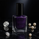 Bottle of Purple Dazzle glitter nail paint with sparkling finish
