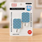 Two blue and black chevron pattern sticky hooks are displayed in their clear retail packaging.
