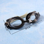 Black and clear swimming goggles with a beige strap on a blue background, showing dimensions of 16 cm and 4 cm.