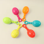 Jingly baby rattle producing soft musical sounds