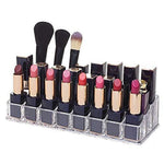 Clear acrylic lipstick holder with 24 sections, showcasing its organized cosmetic storage on a vanity.