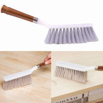 Sturdy household cleaning brush with a long handle, suitable for floors and various surfaces.