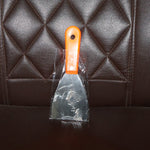 Putty knife with a comfortable soft rubber handle and a hanging hole for easy storage.