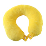 A vibrant yellow U-shaped neck pillow with two white snap buttons on its ends is displayed on a white background.