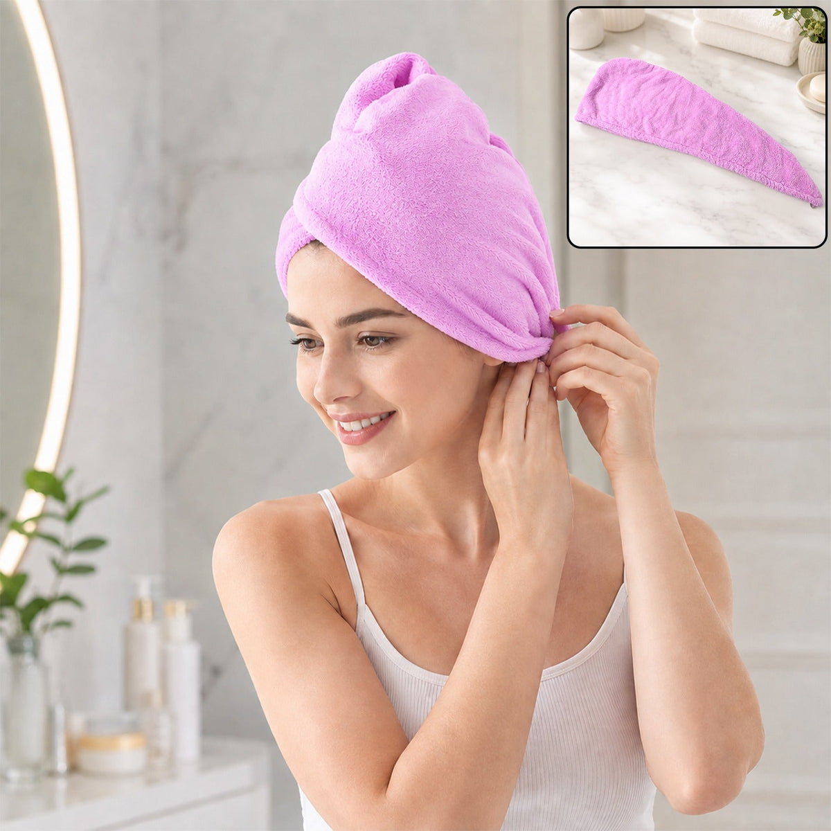 A smiling woman in a white tank top wears a purple microfiber hair wrap, securing it above her ear. 