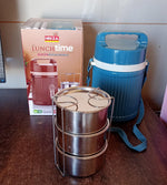 An insulated stainless steel dabba on a table, ready for a healthy meal.