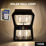 Close-up of the sleek black Solar Wall Lantern mounted on a wall.