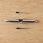 Compact multifunction spinner pen for stress relief and writing