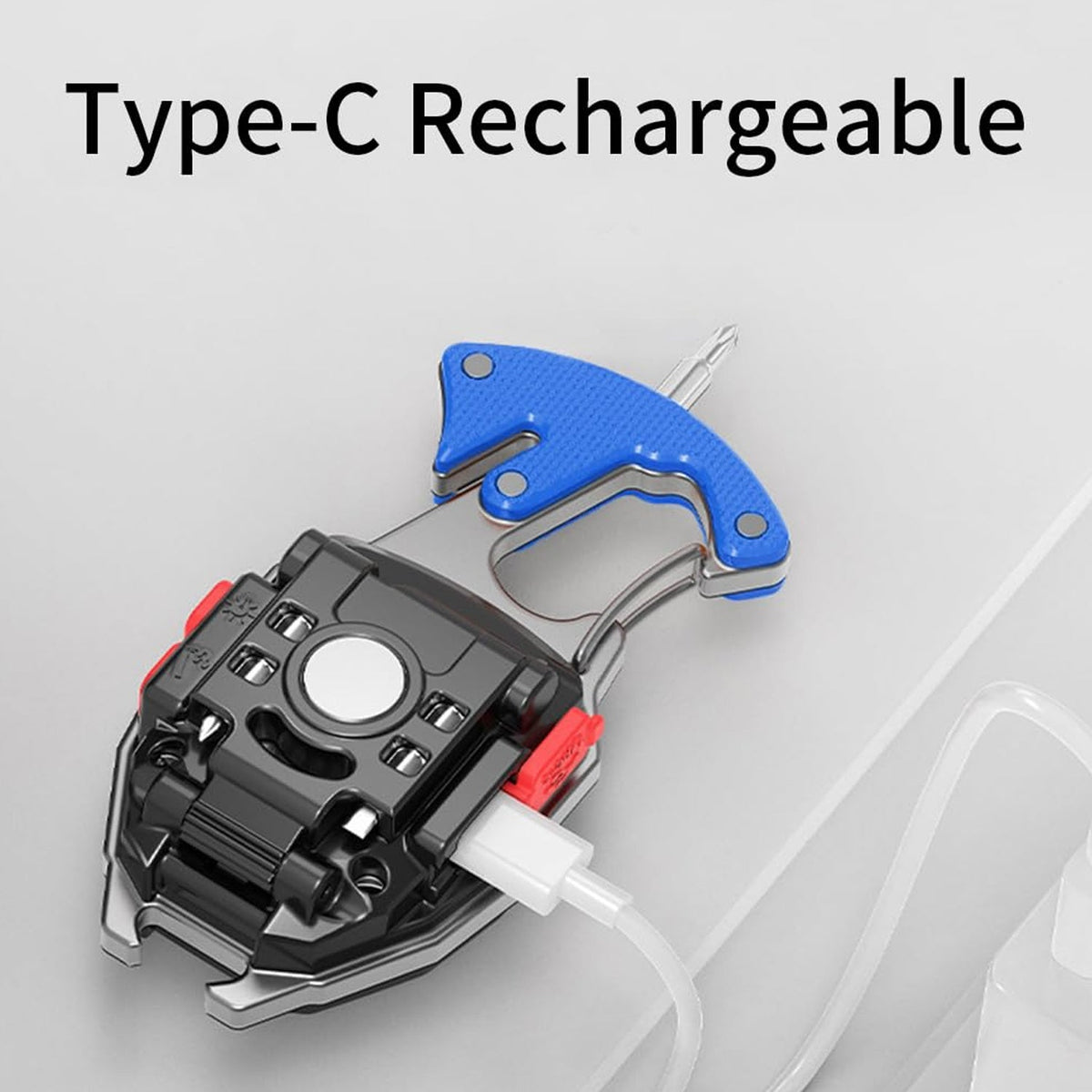 The black and silver keychain light is shown from the back, with a white USB-C cable plugged in for charging.