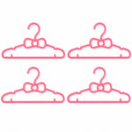 A grid of four pink plastic bow-shaped hangers is displayed against a plain white background.