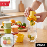 A person dispenses a citrus-infused ice cube from a yellow mold into a glass of water on a wooden counter, – view 2