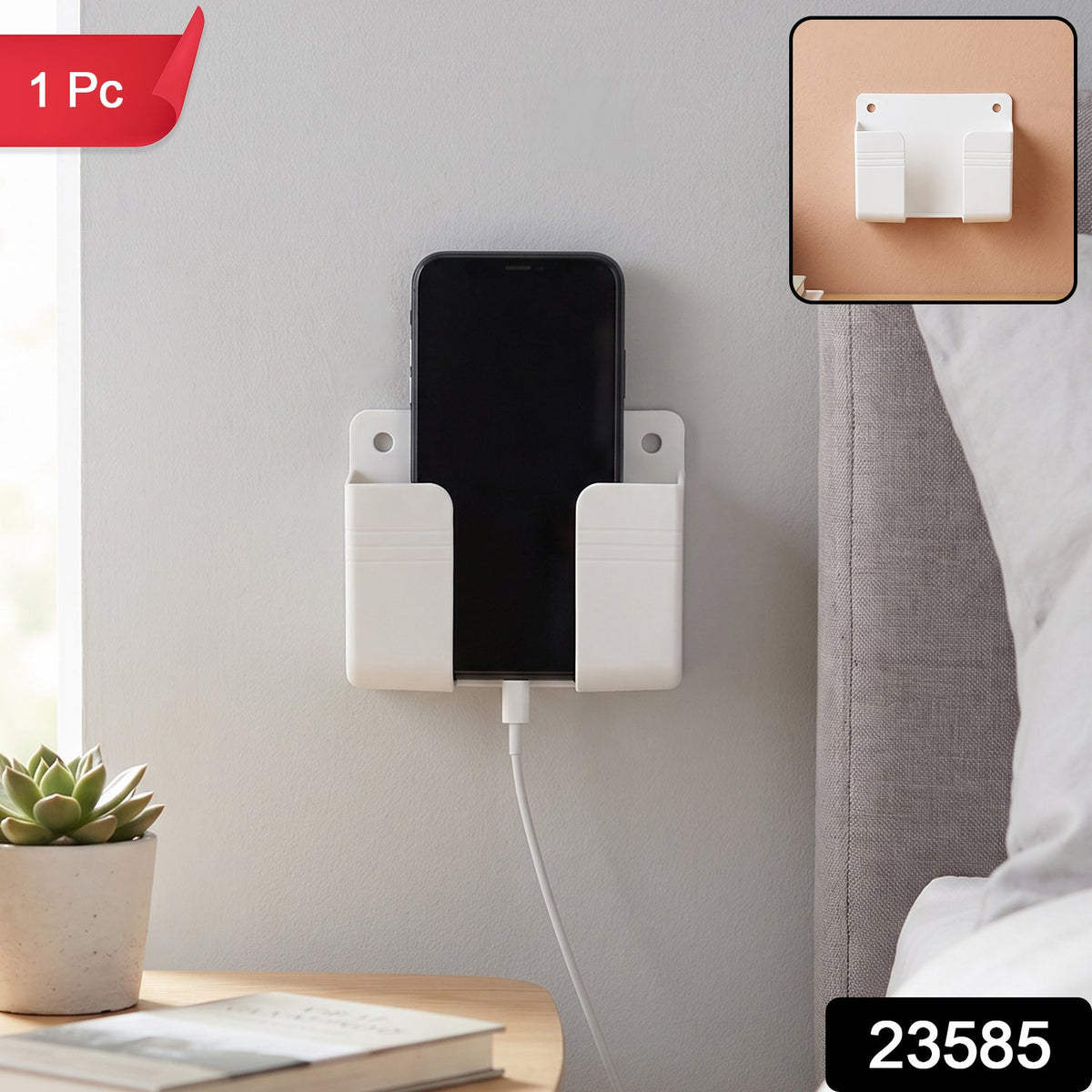 A white wall-mounted phone holder with a black smartphone charging, featuring a red '1 Pc' label and '23585' watermark.
