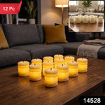 Twelve glowing cream ribbed LED candles sit on a wooden table in a living room, with a small inset showing them unlit.